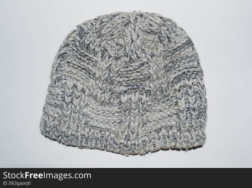 Knitted gray woolen hat isolated. Knitted gray woolen hat isolated