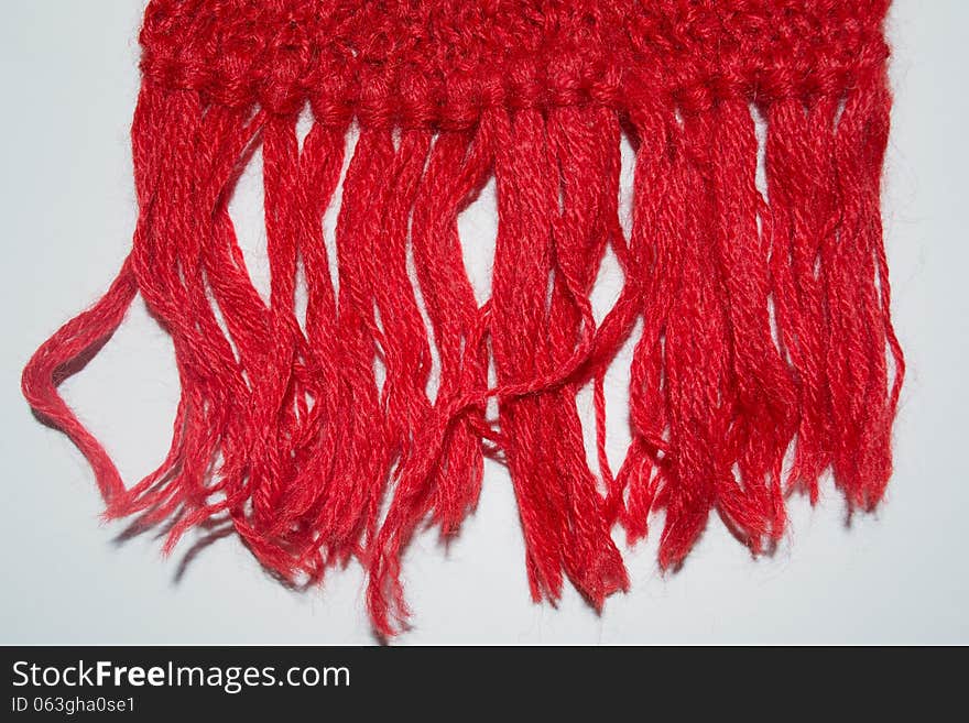 Knitted red wool scarf background. Knitted red wool scarf background