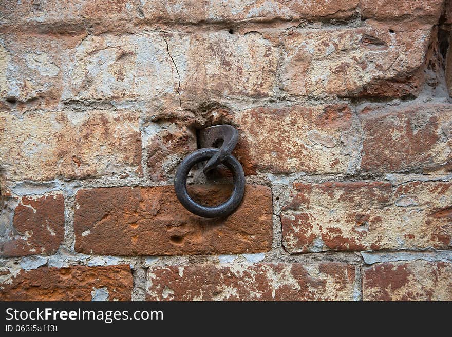 Metal ring in the old wall of red bricks. Metal ring in the old wall of red bricks.