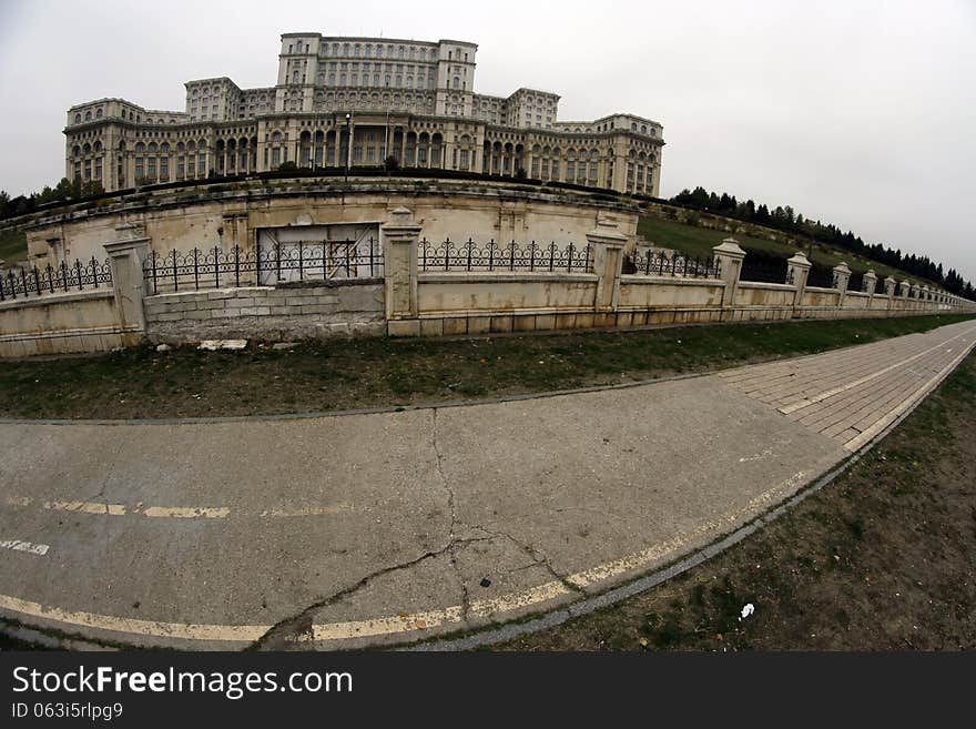 Fish-eye view of the Palace of the Parliament, also known as People's House, a multi-purpose building containing both chambers of the Romanian Parliament. According to the World Records Academy, the Palace is the world's largest civilian building with an administrative function, most expensive administrative building, and heaviest building. The Palace was designed and nearly completed by the Ceaușescu regime as the seat of political and administrative power. Fish-eye view of the Palace of the Parliament, also known as People's House, a multi-purpose building containing both chambers of the Romanian Parliament. According to the World Records Academy, the Palace is the world's largest civilian building with an administrative function, most expensive administrative building, and heaviest building. The Palace was designed and nearly completed by the Ceaușescu regime as the seat of political and administrative power.