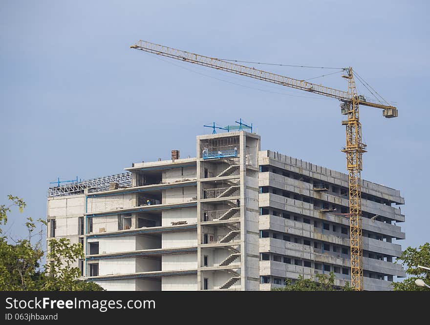 Construction site with cranes on sky background