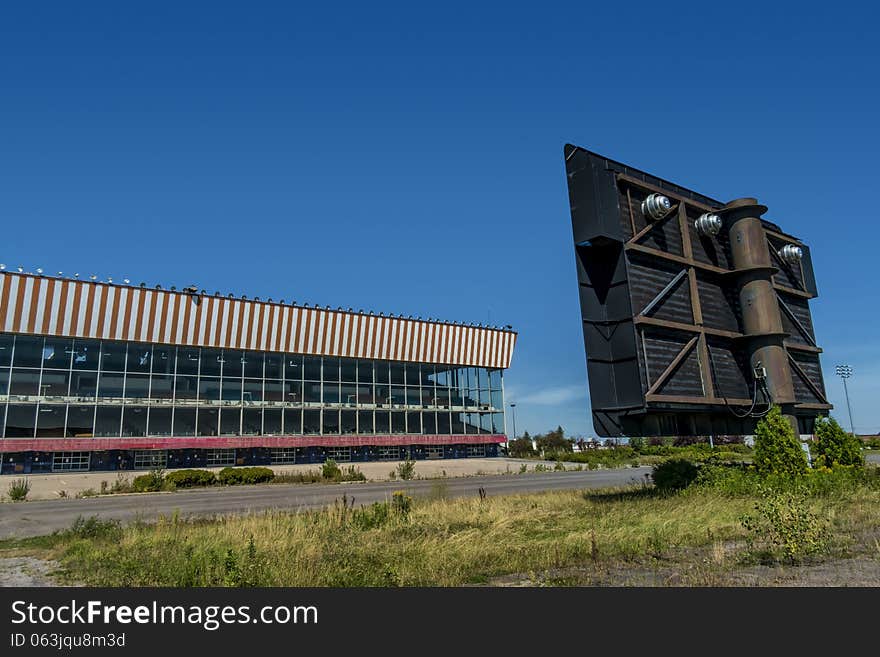 View of a closed horse race track with a big screen on a blue sky