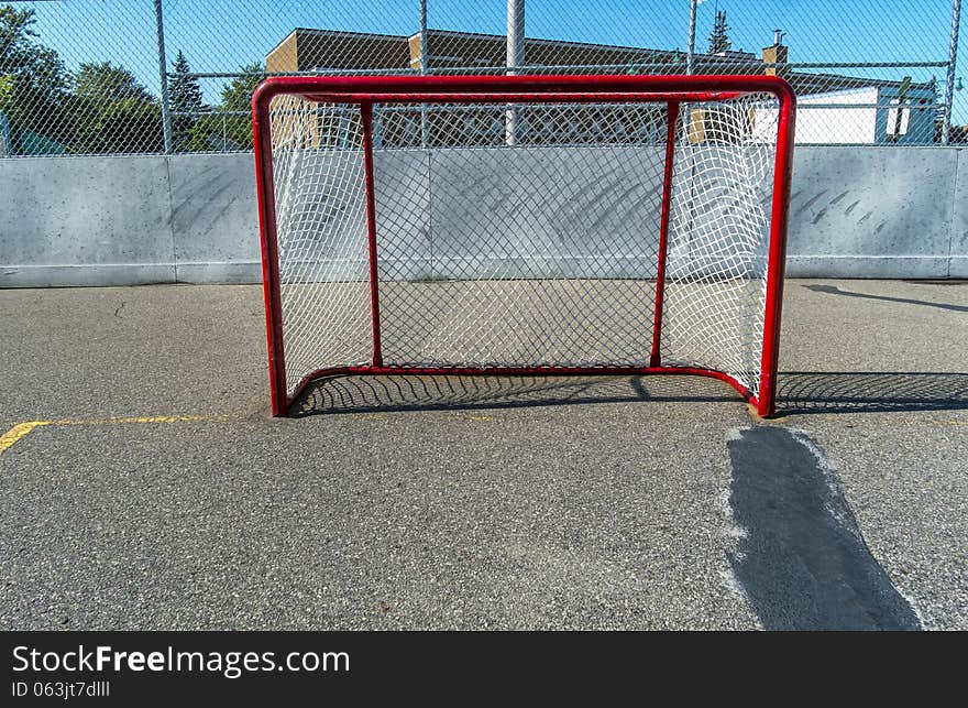 Hockey goal in the sun outside on a nice day