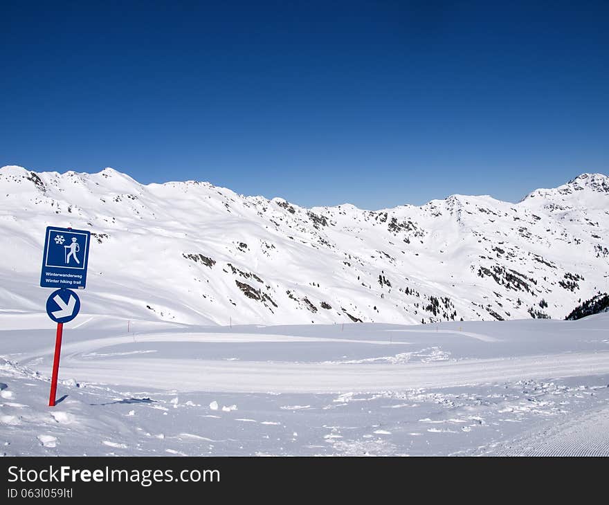 Winter hiking trail in the alps