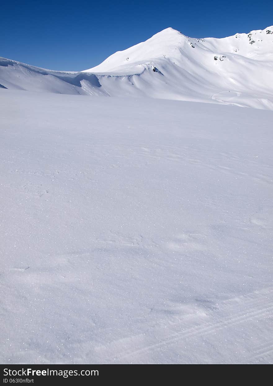 Winter landscape background high in the alps