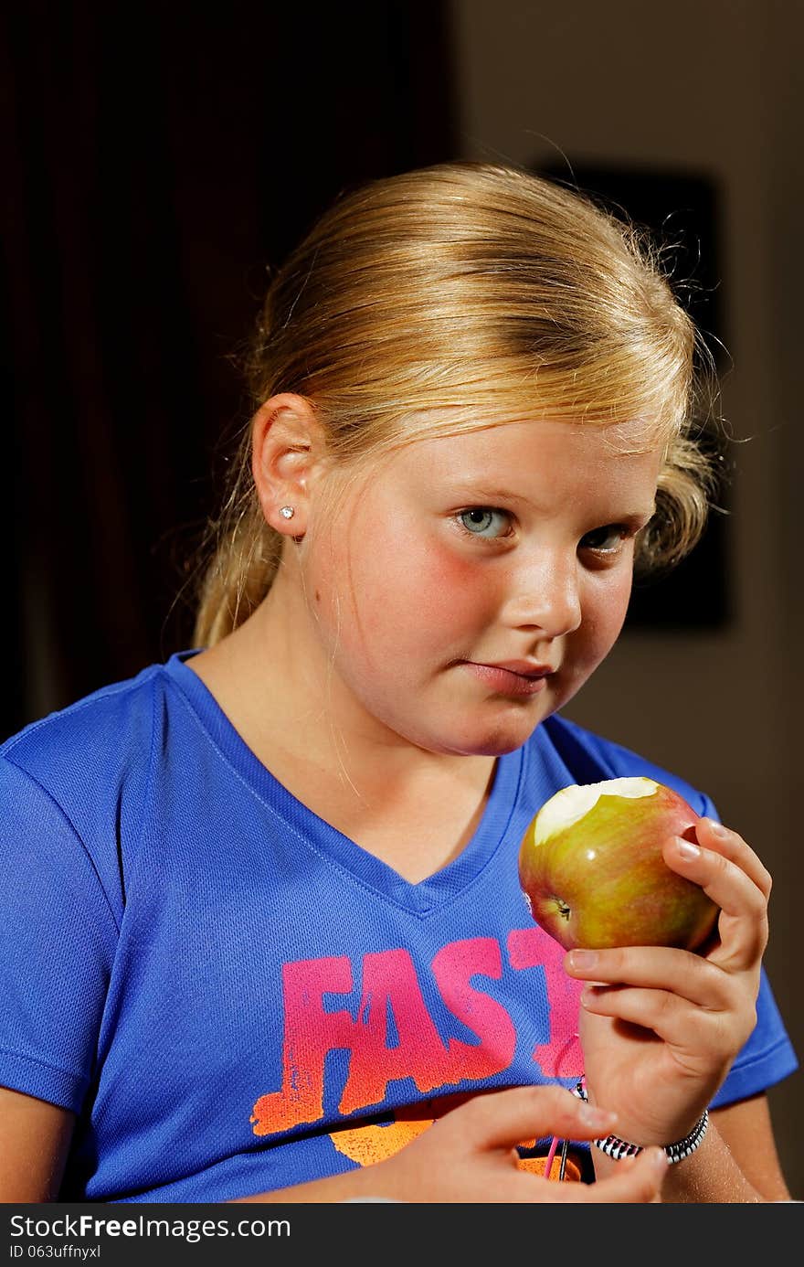 Girl eating apple