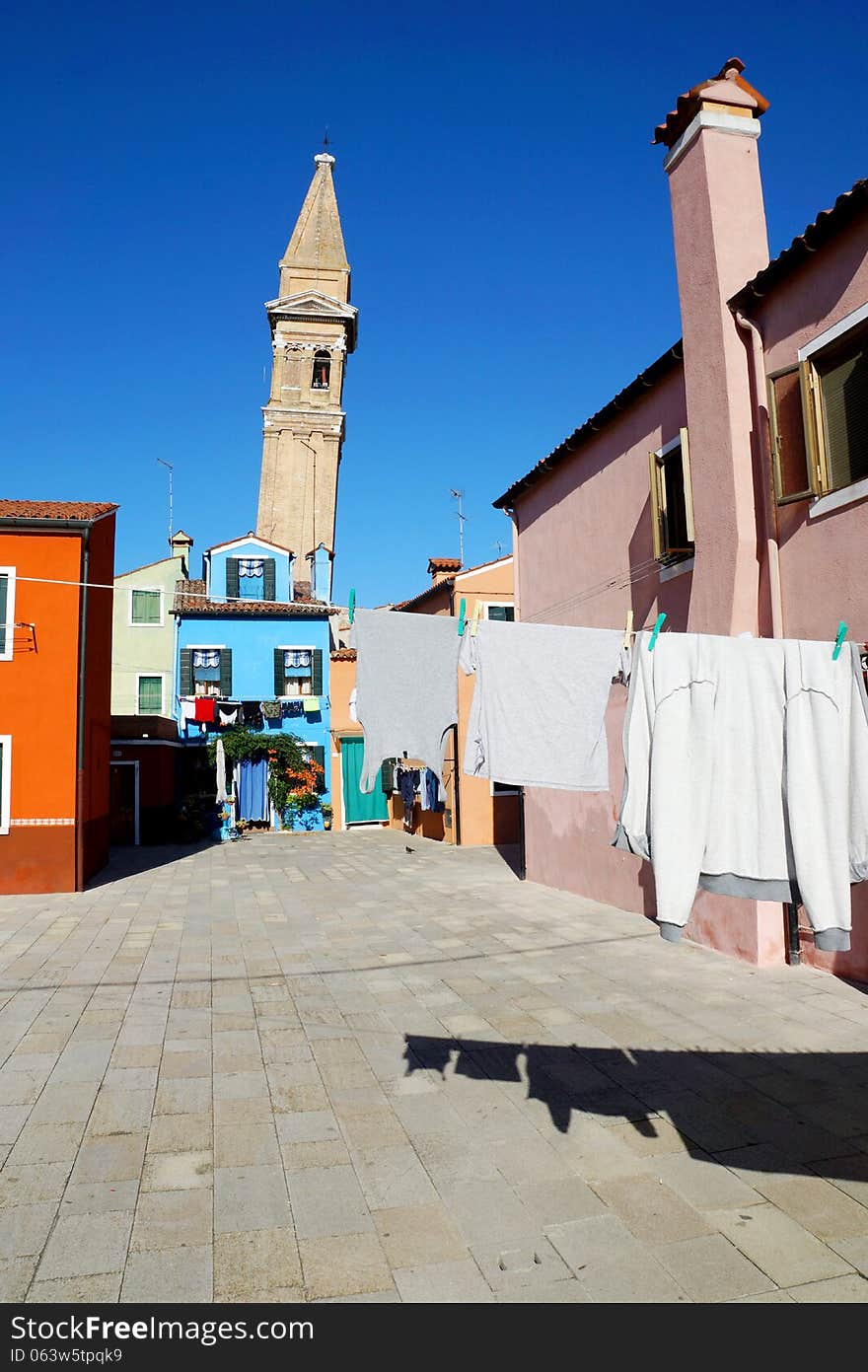 Drying clothes on a background of multi-colored facades of the i