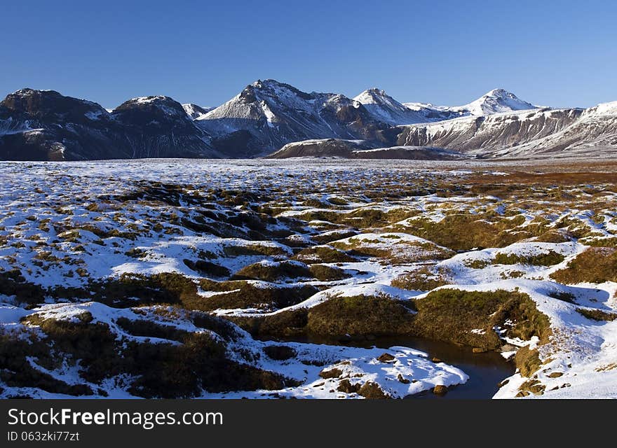 Stream of Water through the quagmire below Reydarbarmur, Laugvartn, Iceland