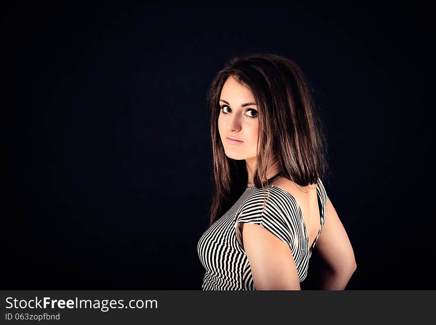 Portrait of young nice sensual girl in studio on black background. Portrait of young nice sensual girl in studio on black background