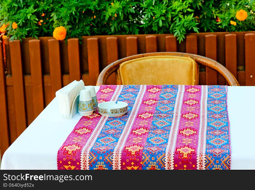 A table covered with a cloth with oriental patterns