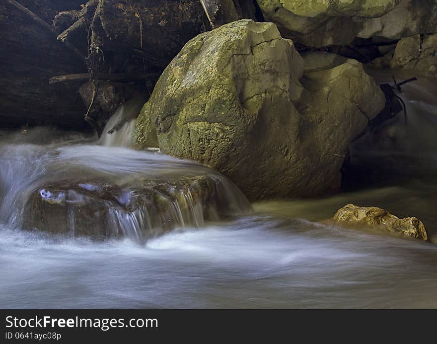 Water on long exposure, falling from a big rock. Water on long exposure, falling from a big rock