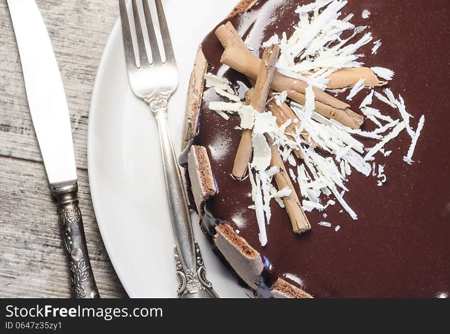 French chocolate cake covered with mirror chocolate icing. Macro