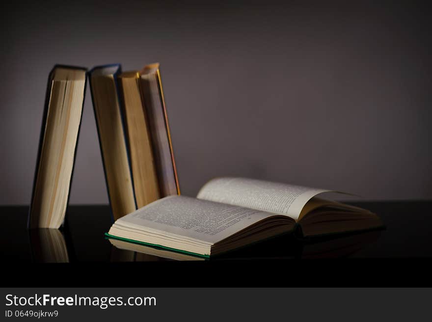 Vintage old books on wooden deck table and grunge background. Vintage old books on wooden deck table and grunge background