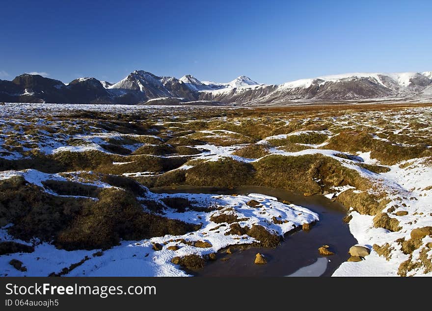 Stream of Water through the Mire below Laugvartnsfjall, Laugvartn, Iceland