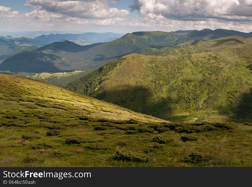 View from the mountains in the shadows of the clouds (view from The Hoverla mountain). View from the mountains in the shadows of the clouds (view from The Hoverla mountain)