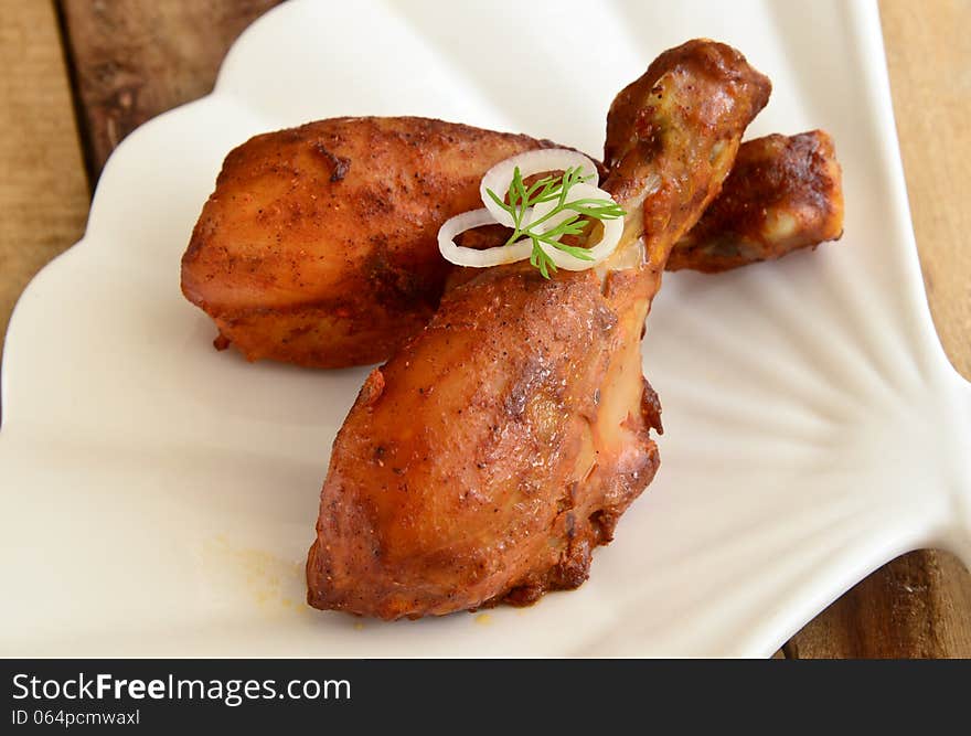 Chicken Tandoori is a highly popular Indian dish consisting of roasted chicken, yogurt, and spices. Chicken Tandoori is a highly popular Indian dish consisting of roasted chicken, yogurt, and spices.