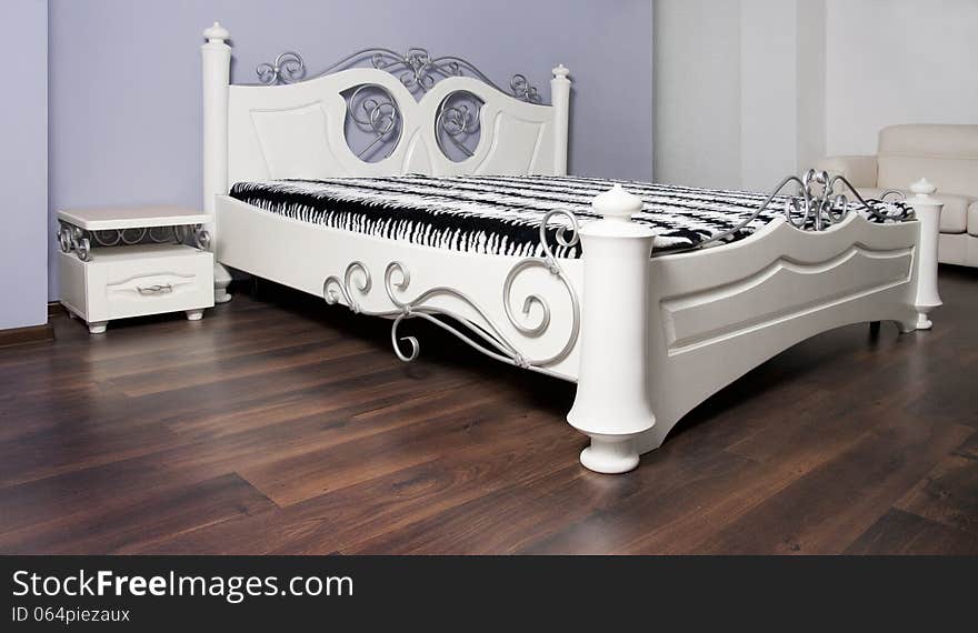 White bed in modernist style