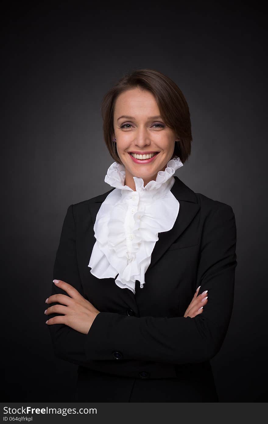 Business woman on dark grey background