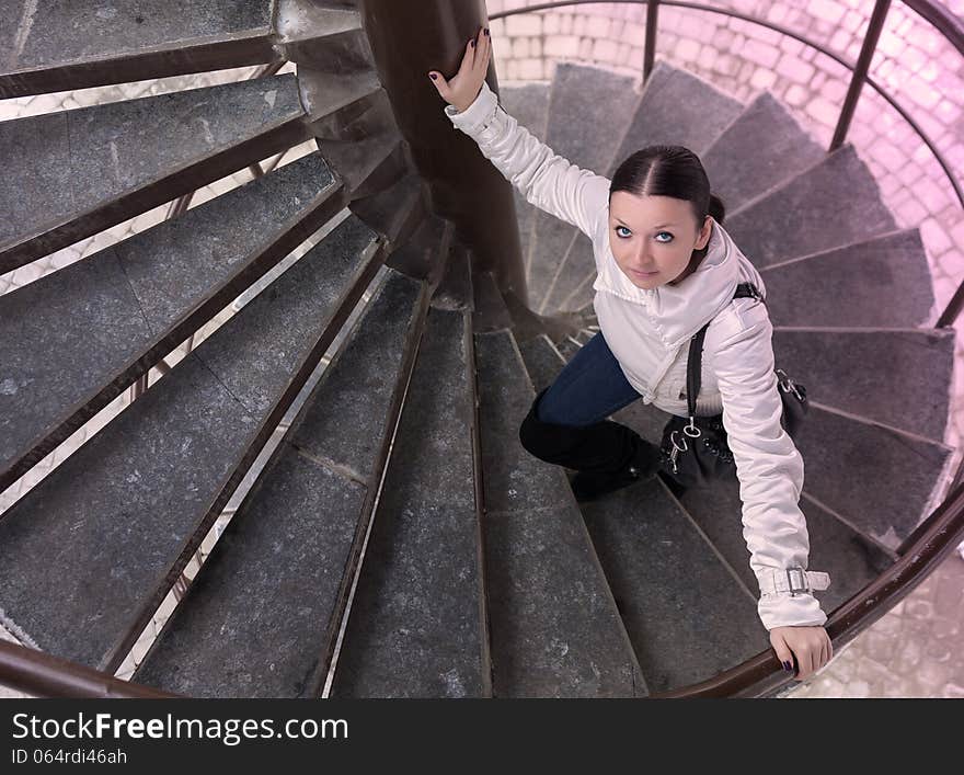 Pretty girl climbs the ladder