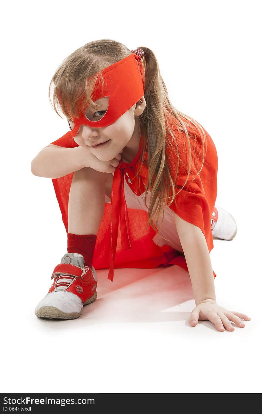 Superhero little girl in a red raincoat and a mask. Superhero little girl in a red raincoat and a mask