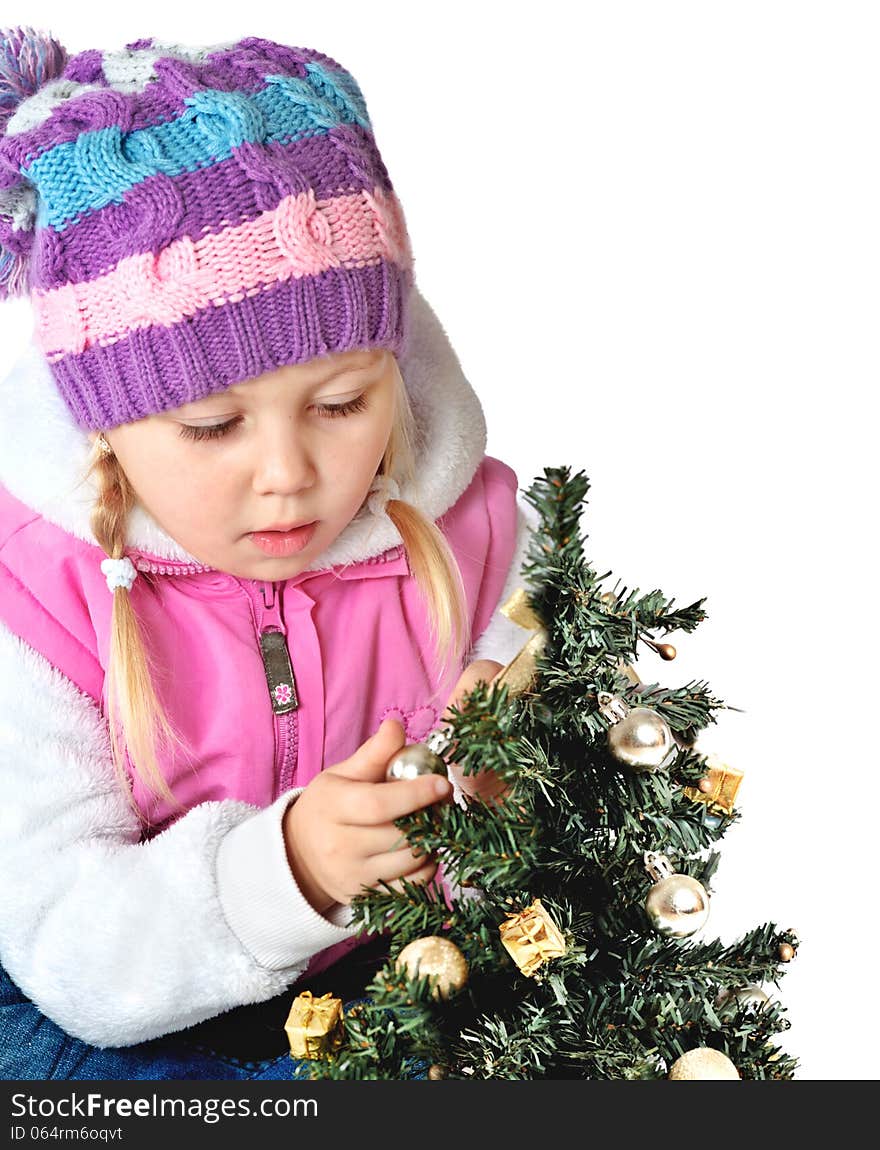 Portrait of a little girl dressed in winter clothes, christmas, new year, Christmas tree