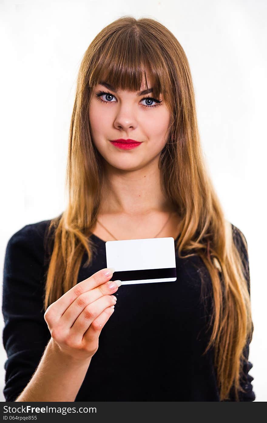 The pretty, young girl holds out business card. Isolated on white. The pretty, young girl holds out business card. Isolated on white.