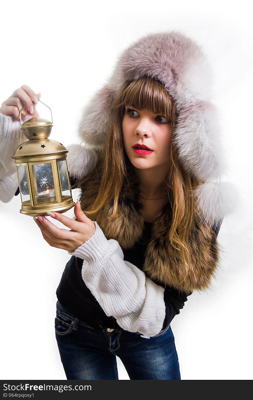 The pretty, young Girl holds the lamp. Isolated. Isolated on white.