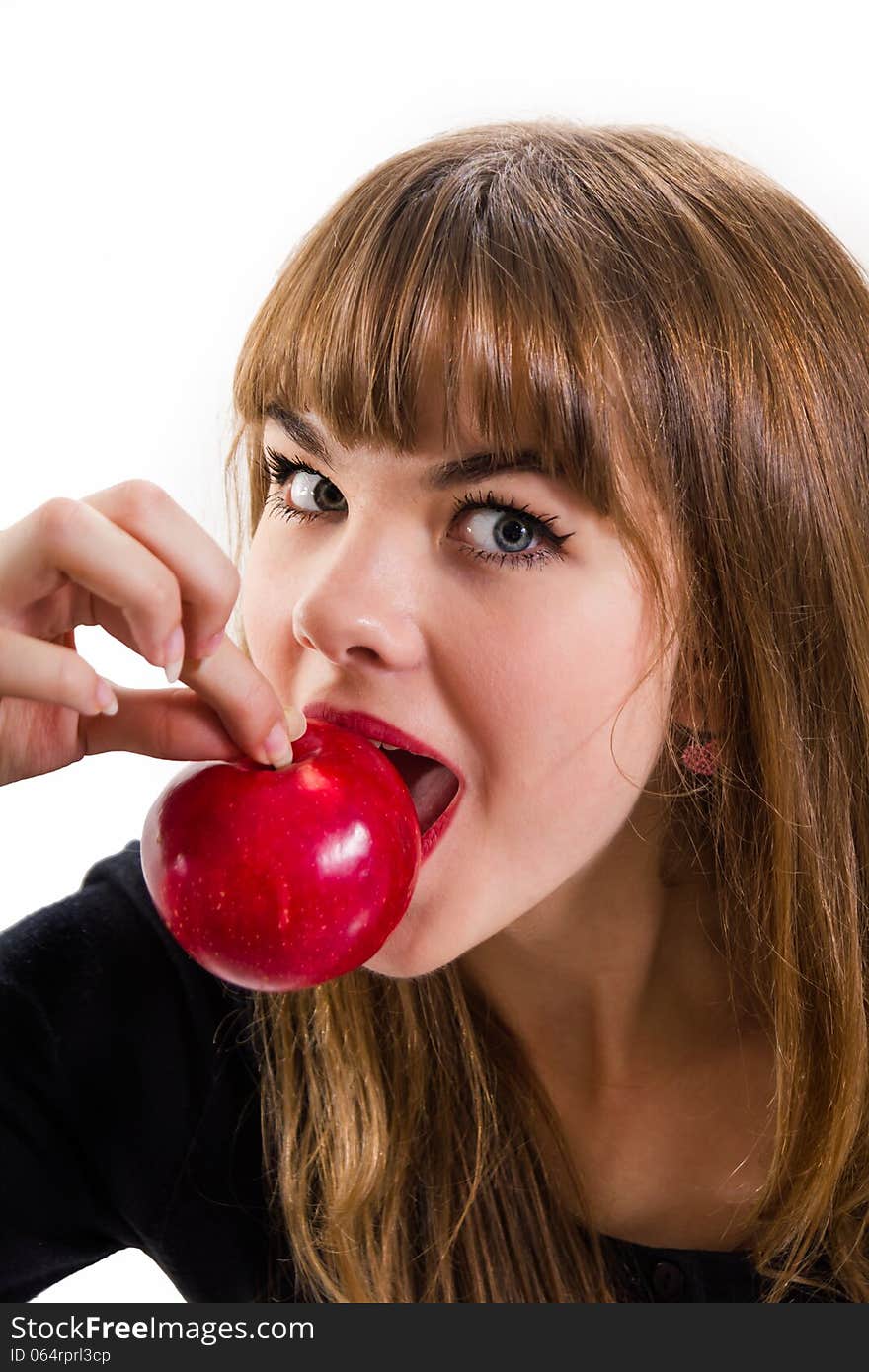 The pretty, young Girl and red apple. Isolated on white.