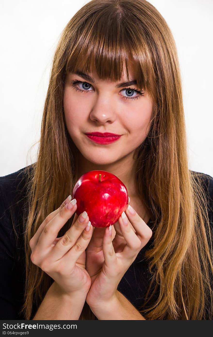 The pretty, young Girl and red apple. Isolated on white.