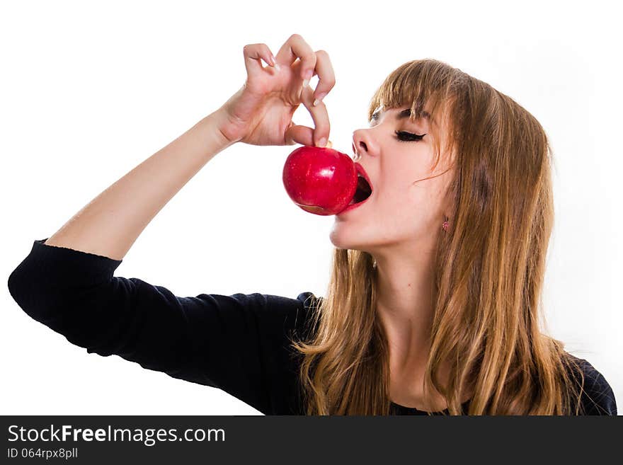 The pretty, young Girl and red apple. Isolated on white.