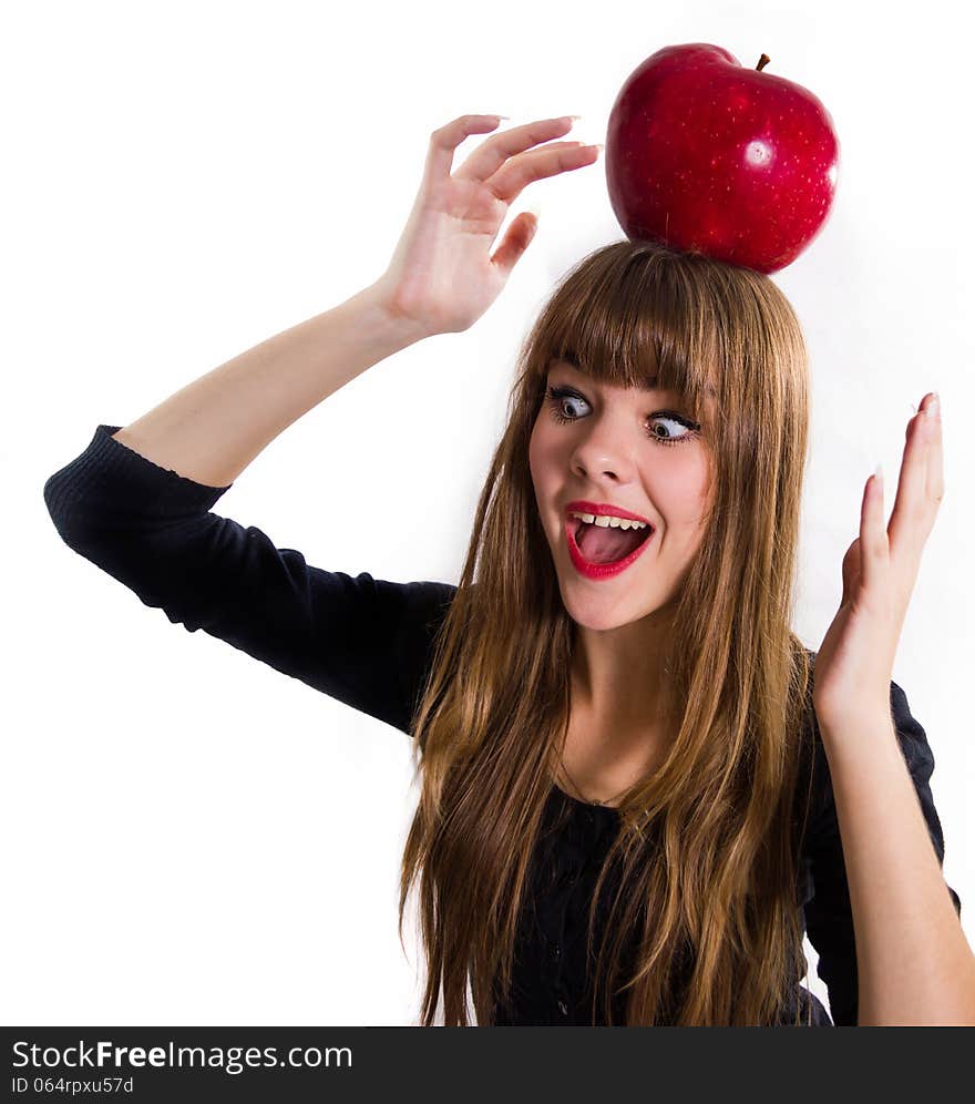 Pretty, young Girl and red apple. Isolated on white.