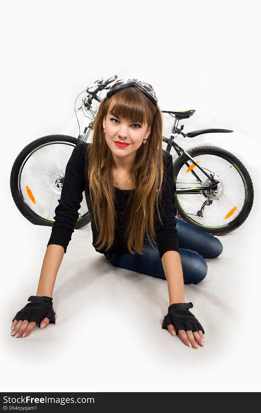 The pretty, young girl with bike. Isolated on white.