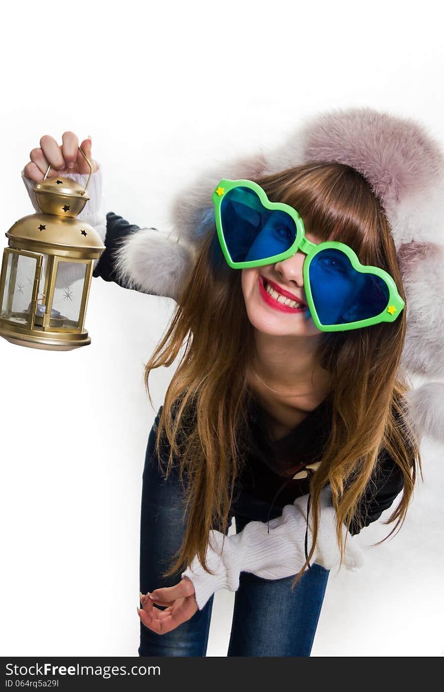 Cheerful woman with big sunglasses.Small lamp in a hand, isolated. Cheerful woman with big sunglasses.Small lamp in a hand, isolated.