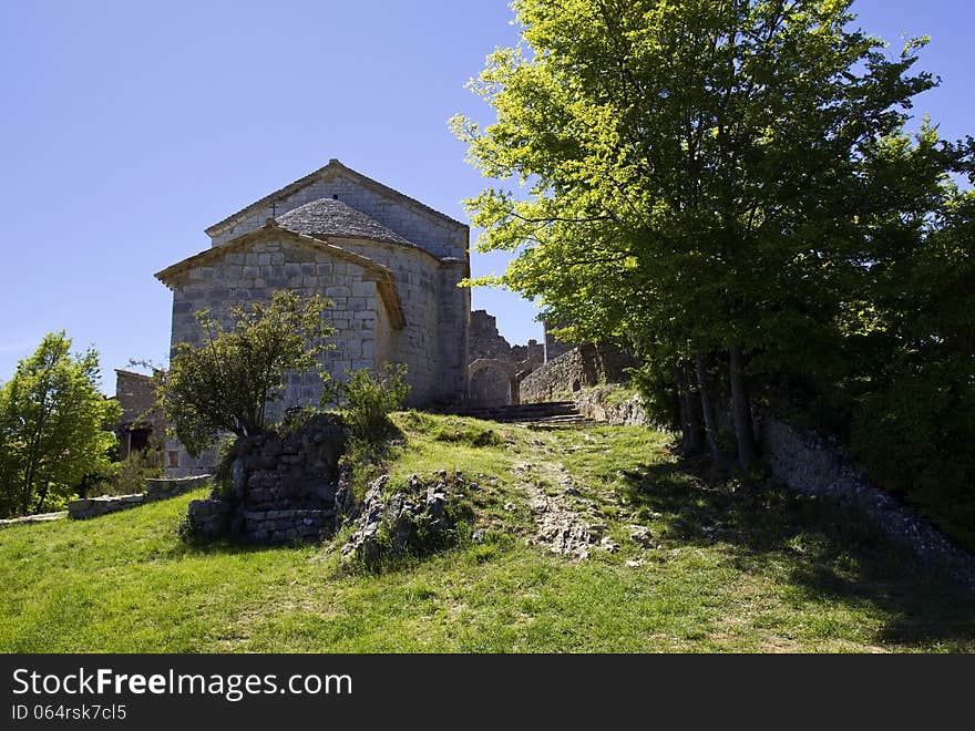 Église Saint Nicolas and Castle Archway in the beautiful French mountain village of Bargeme perched at 1097 meters, Bargème is the highest village in The Var, South of France. Église Saint Nicolas and Castle Archway in the beautiful French mountain village of Bargeme perched at 1097 meters, Bargème is the highest village in The Var, South of France.