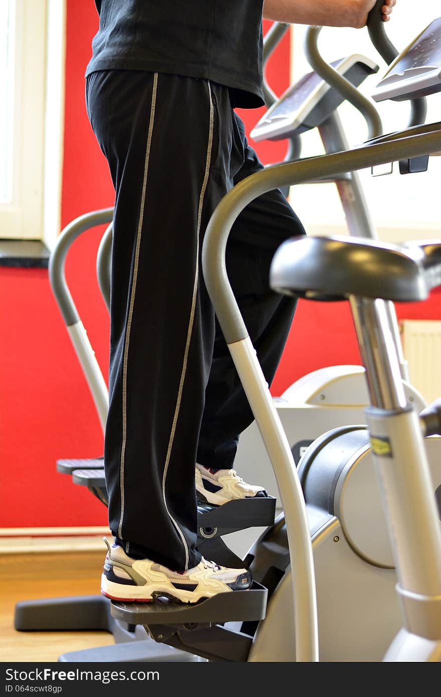 Man working out on a stair machine