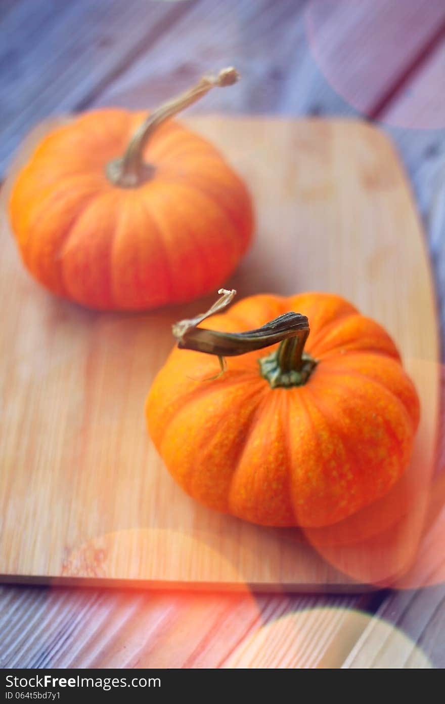 Pumpkins on wooden kitchen table