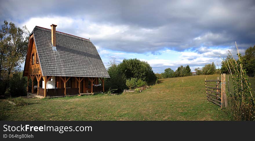 Panoramic view about a traditional transylvanian wood house. Panoramic view about a traditional transylvanian wood house.