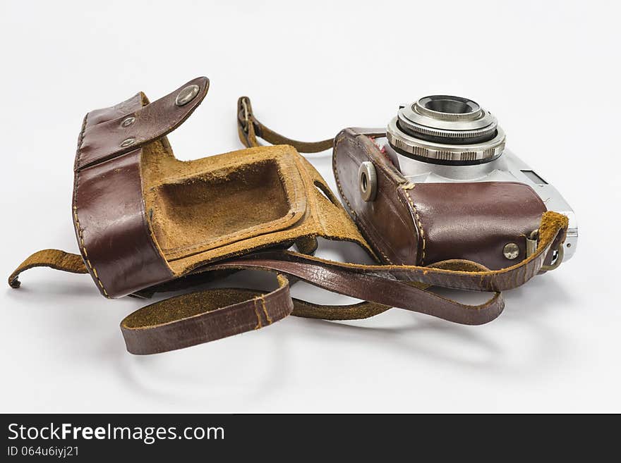 Retro camera isolated on white background in leather pack. Retro camera isolated on white background in leather pack.