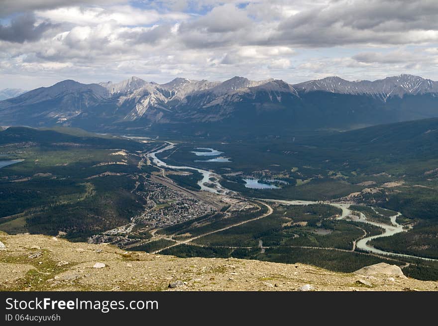 Ariel view of the town of Jasper and the surrounding area including the mountain range in the background. Ariel view of the town of Jasper and the surrounding area including the mountain range in the background