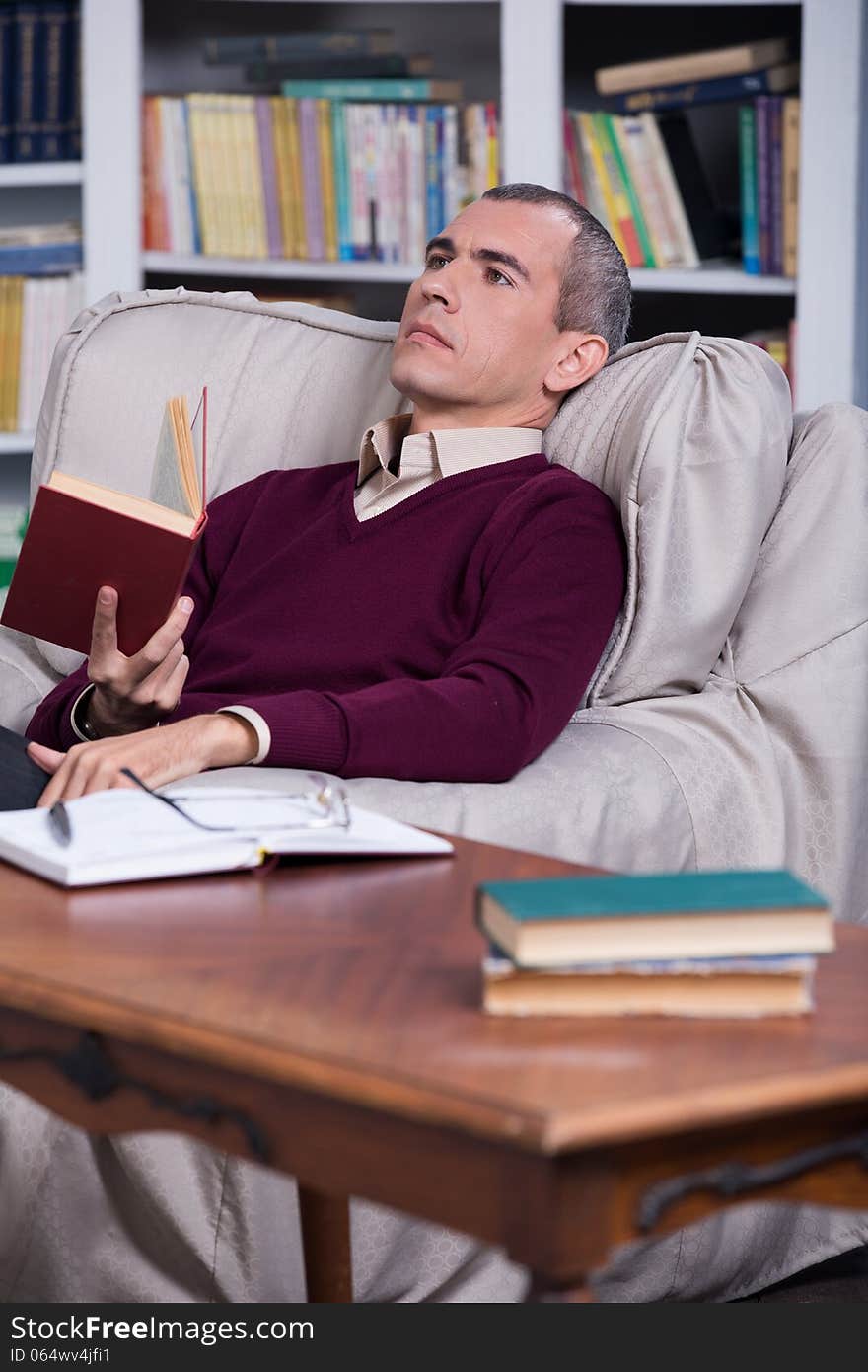 Handsome successful lawyer reading a book. Handsome successful lawyer reading a book