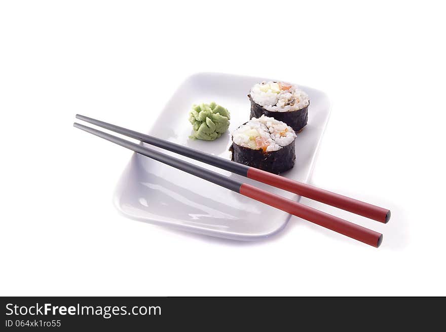 Sushi on a plate with chopsticks. Sushi on a plate with chopsticks