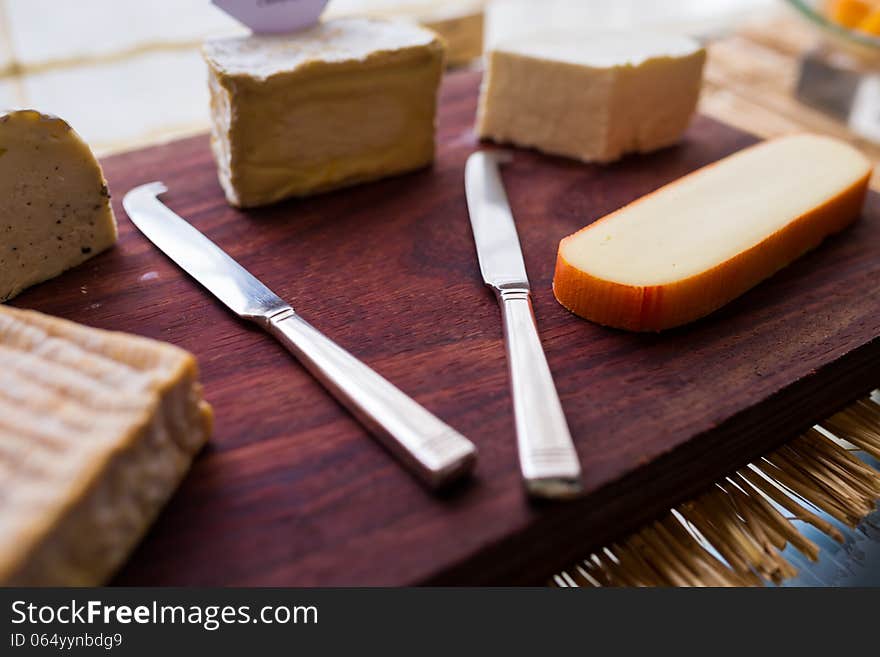 Butter knife with variety of cheese. Butter knife with variety of cheese