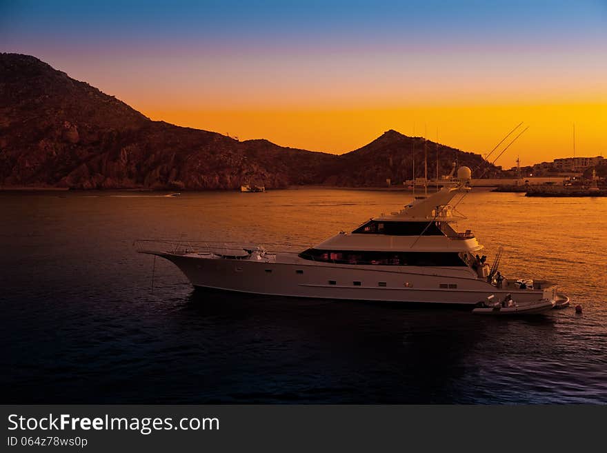 Luxury yacht in the harbor at sunset in Cabo San Lucas, Mexico