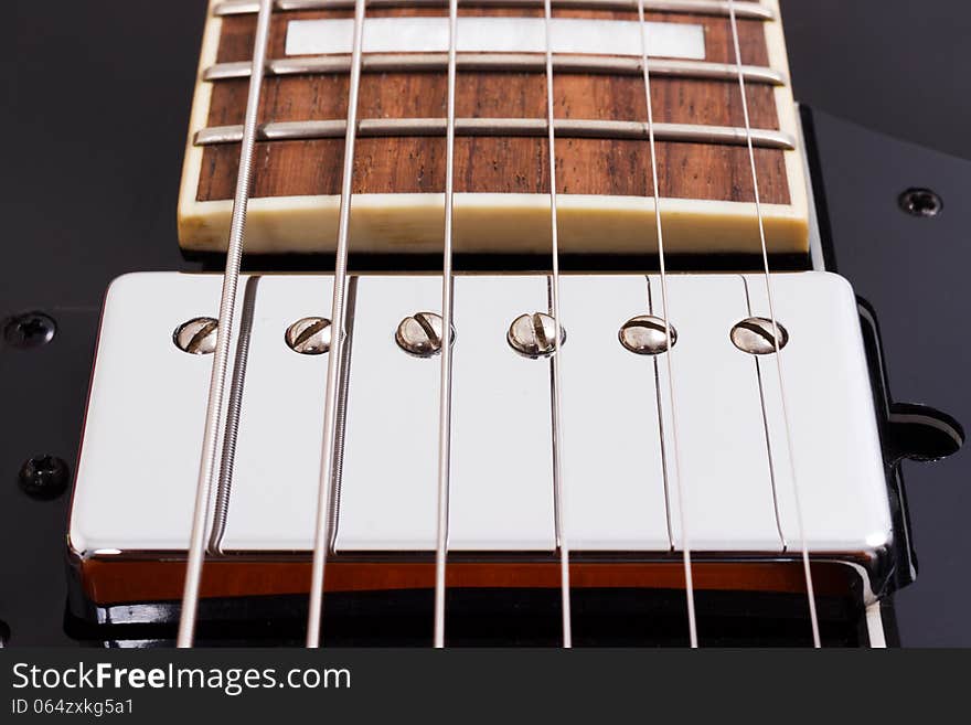 Detail of an electric guitar humbucking pickup. Detail of an electric guitar humbucking pickup