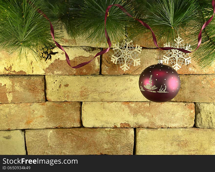 Purple Bauble On Brick Wall