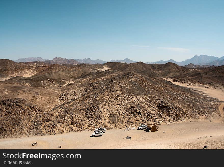 Three cars in the desert of Africa