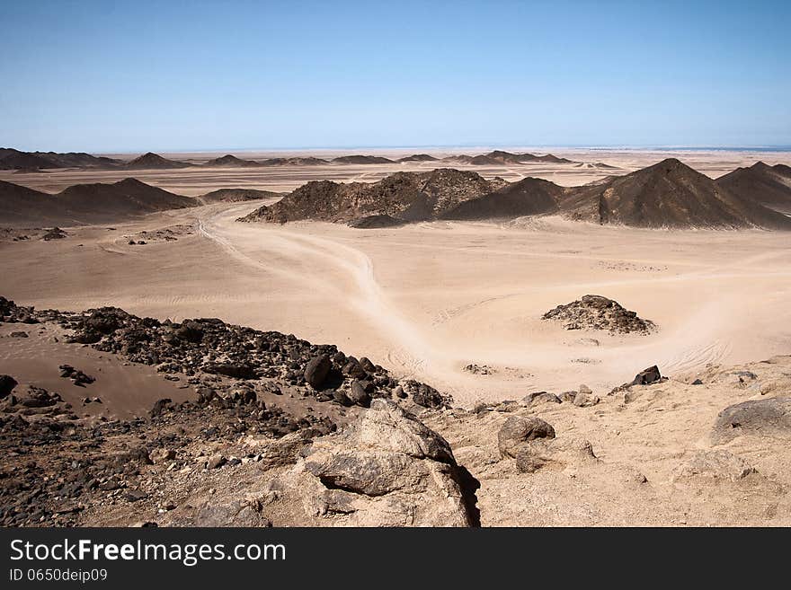 Road in the African desert among the mountains