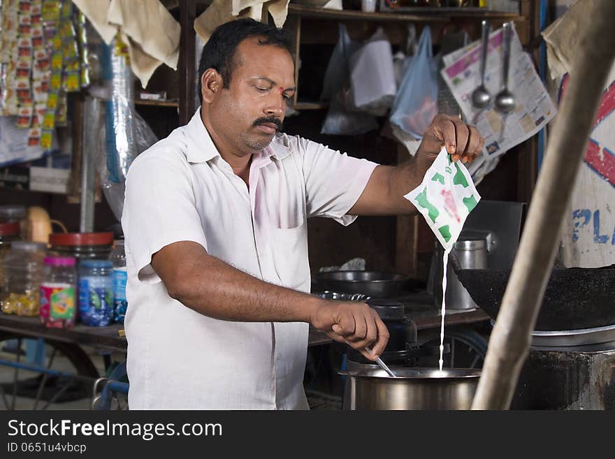 Indian Roadside tea vendor making tea