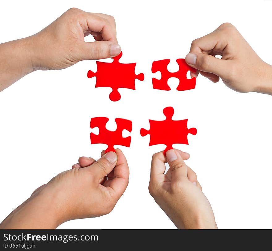 Hands and puzzle isolated on white background