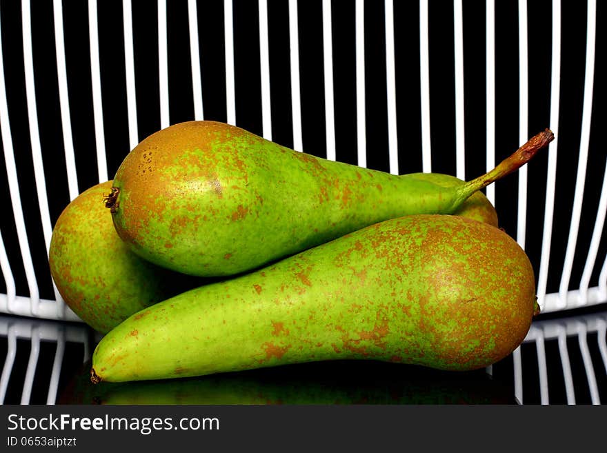 Three pears stacked